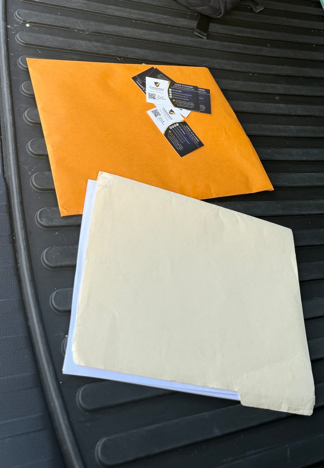 Document envelopes and Covenant Notary business cards ready for delivery